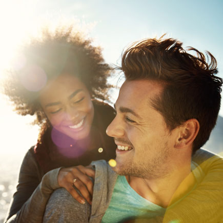 A smiling couple with beautiful teeth in Rochester, NY.