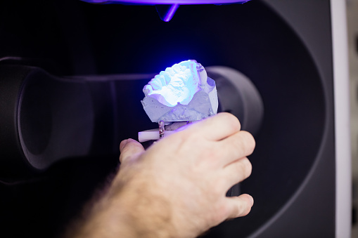 Dentist using 3D scanning for dentures, at Stephen L Ruchlin DDS in Rochester, NY.