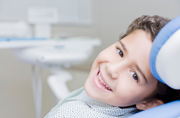 Young boy smiling with healthy teeth at Stephen L Ruchlin DDS in Rochester, NY