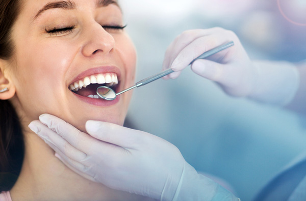 Woman getting dental exam at Stephen L Ruchlin DDS in Rochester, NY.